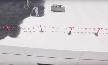 Man applying spray roofing